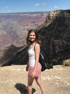 Angela smiling in front of the Grand Canyone